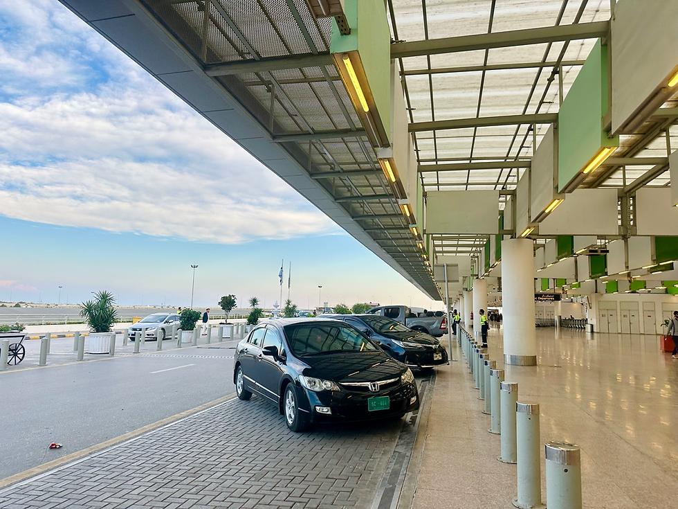 Rental car ready for passenger pickup at Islamabad International Airport.